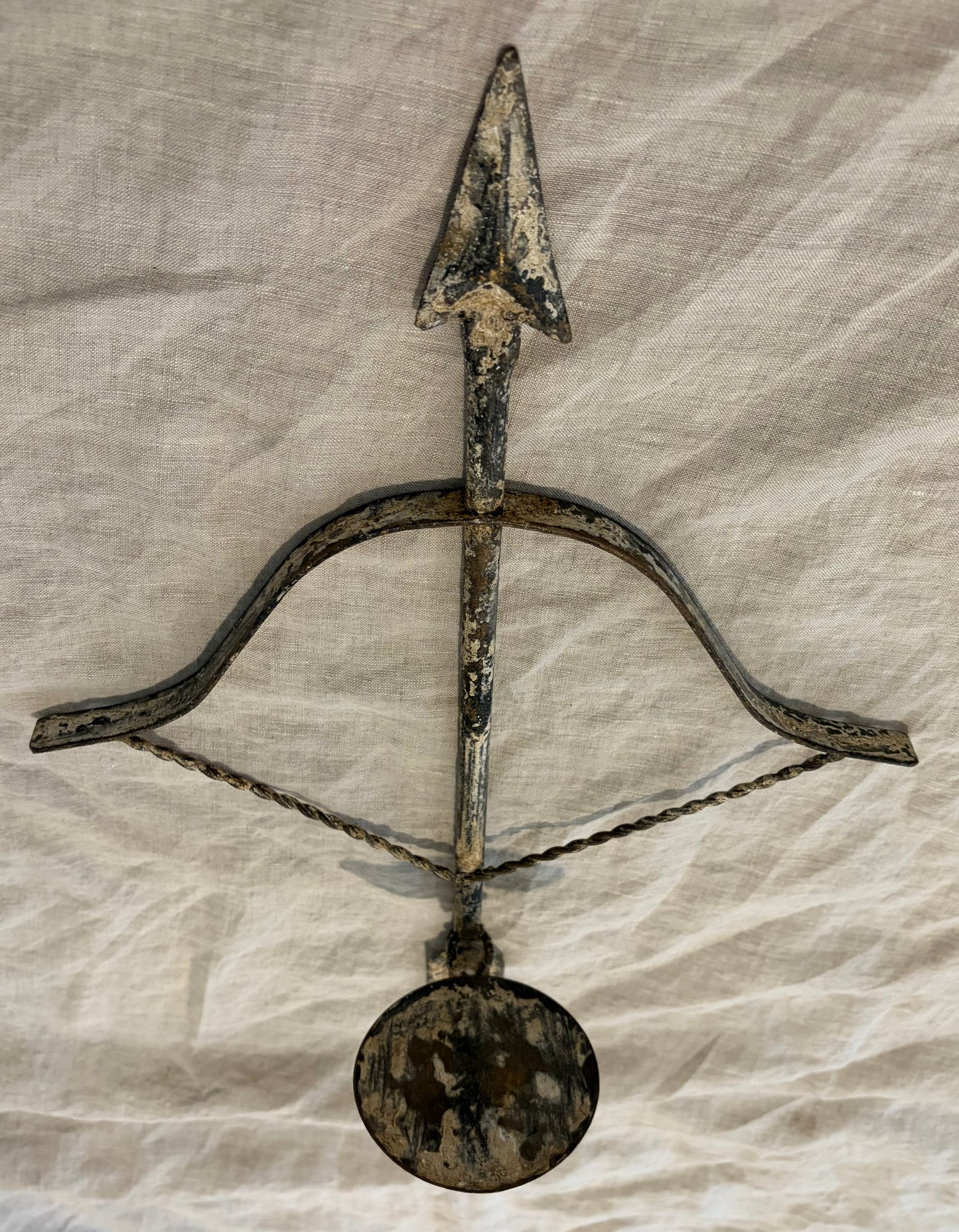 Pair of Patinated Tole Archer or Crossbow Form Candle Holders