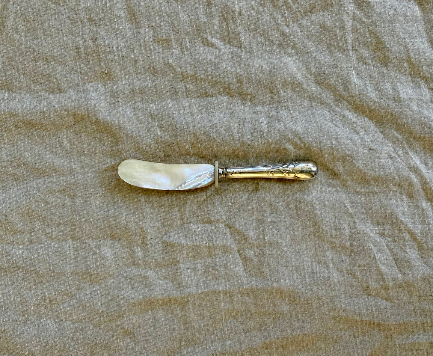 Mother of Pearl Spreader With Sterling Silver Handle.