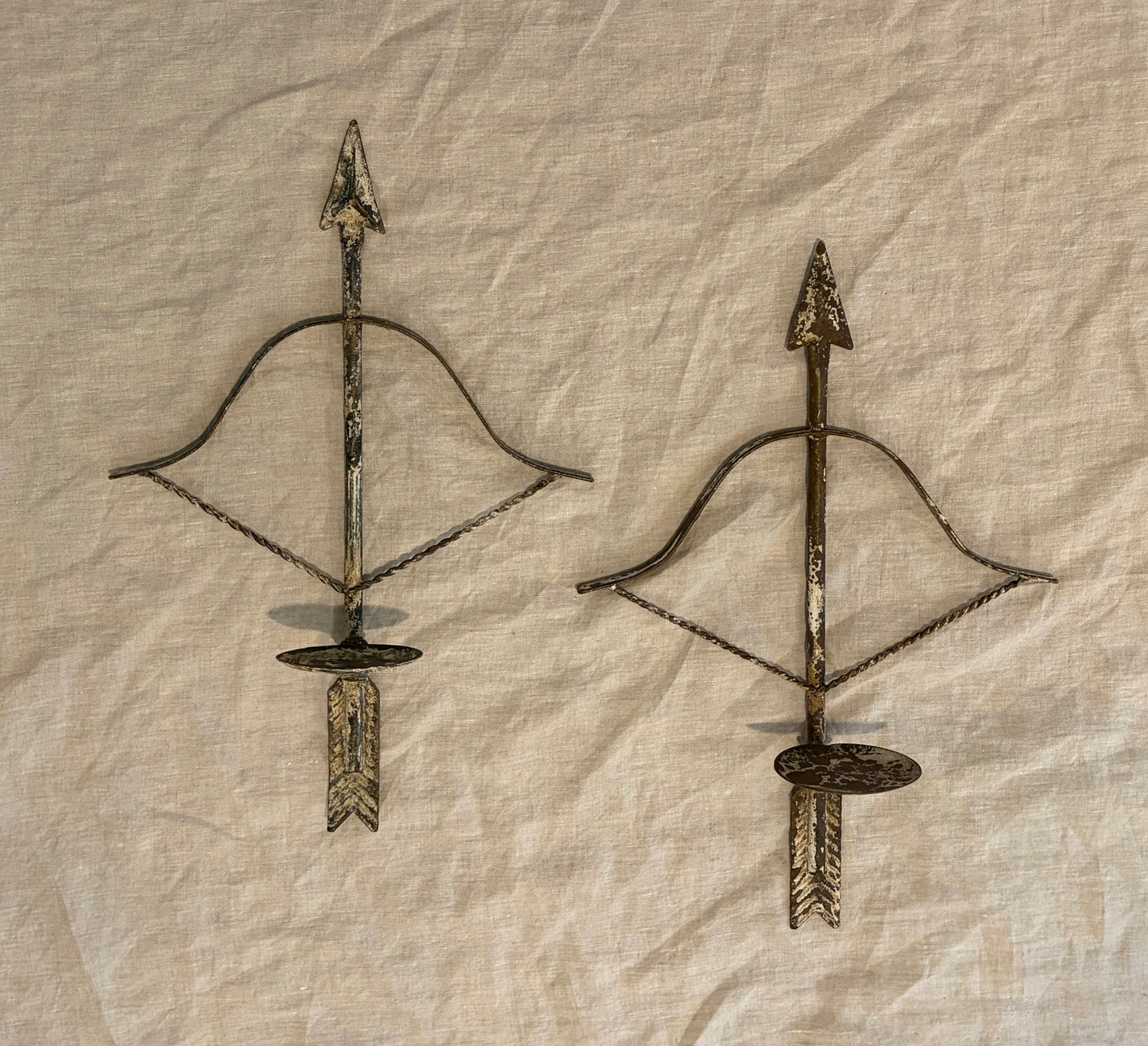 Pair of Patinated Tole Archer or Crossbow Form Candle Holders